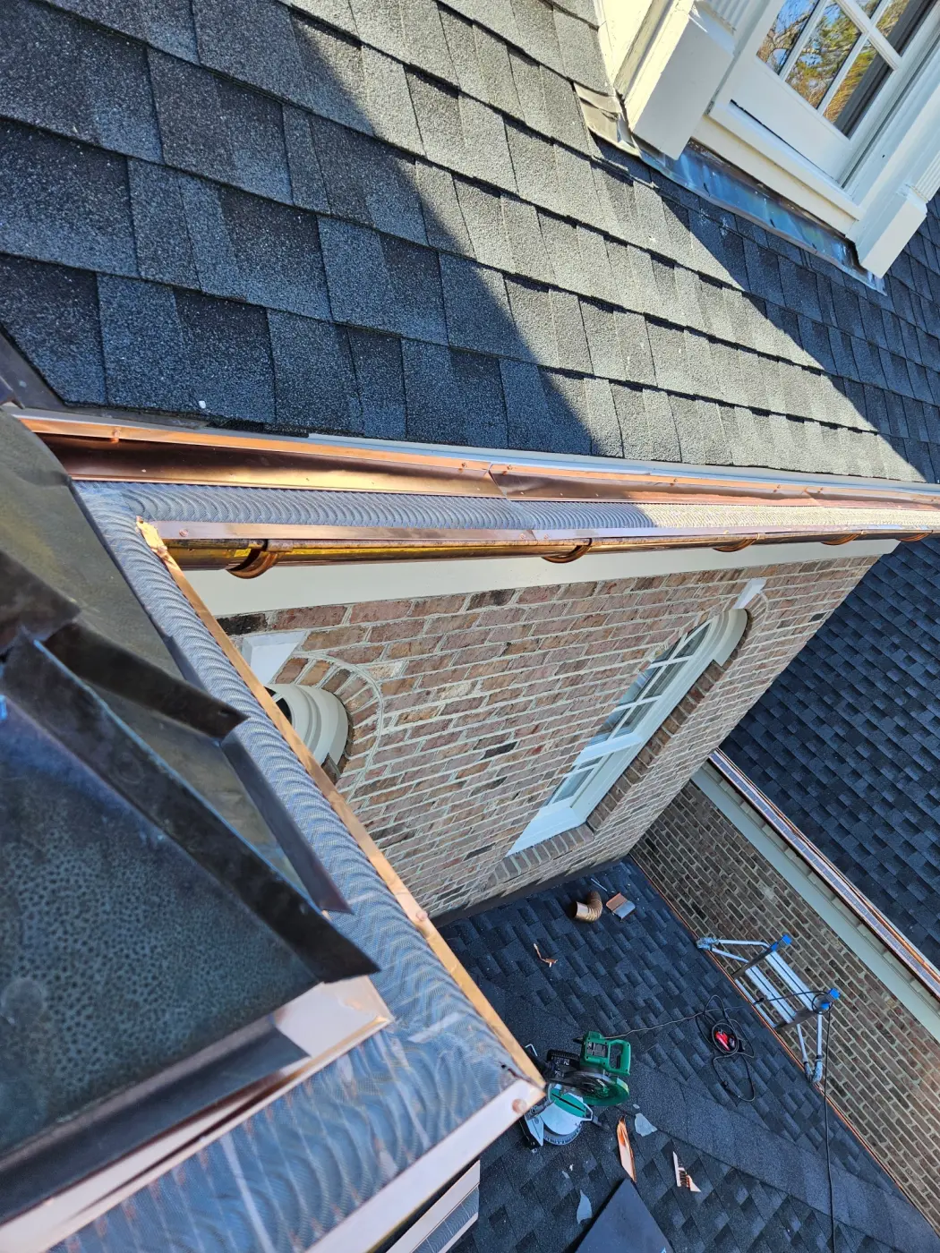 elite-home-services-nc-copper-gutter-guard-two-story-brick-home.webp