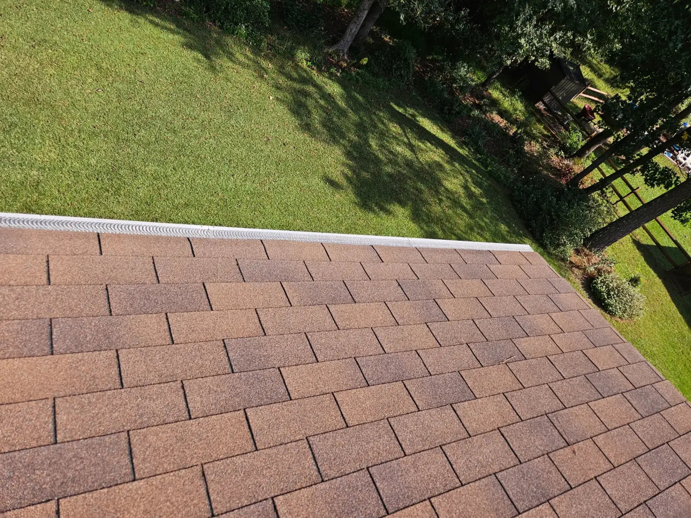 elite-home-services-nc-roof-gutter-guard-completed-backyard.webp