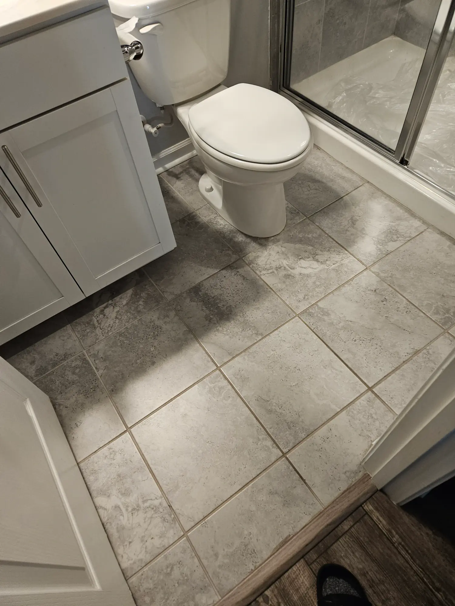 elite-home-services-nc-bathroom-remodel-tile-floor-vanity-toilet.webp