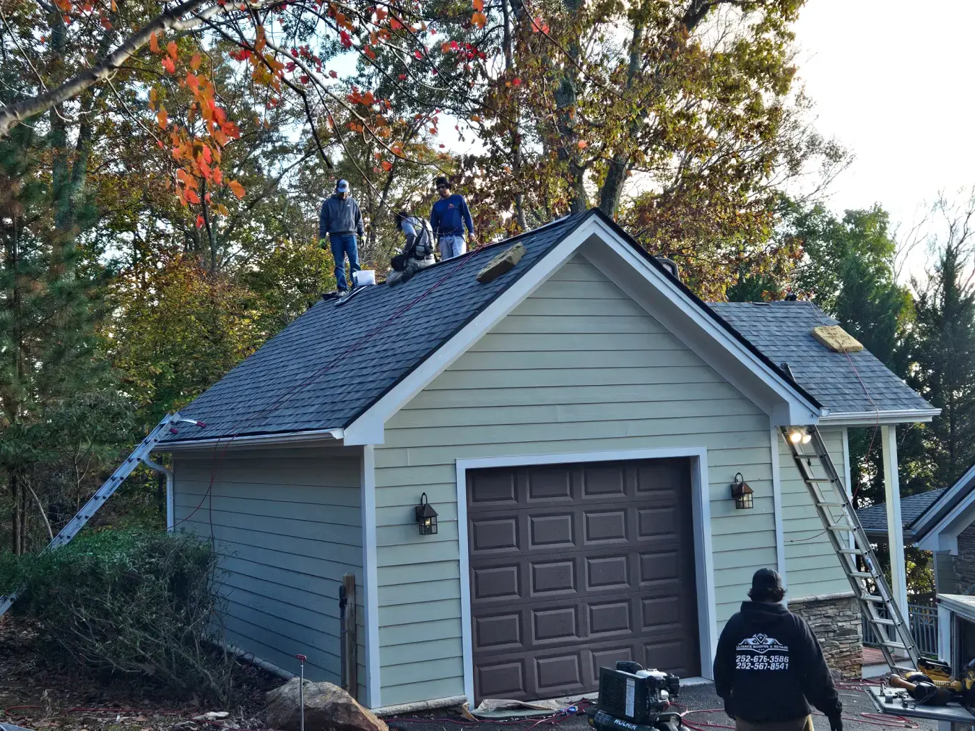 elite-home-services-nc-garage-roof-replacement-crew-shingling.webp