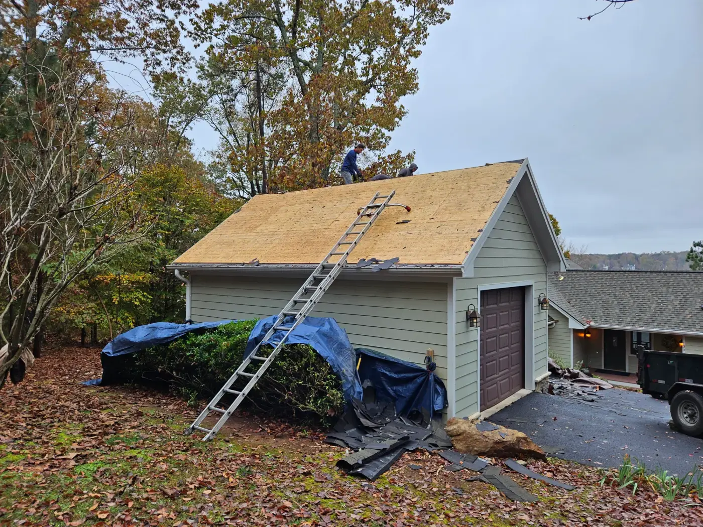 elite-home-services-nc-garage-roof-replacement-decking-exposed.webp