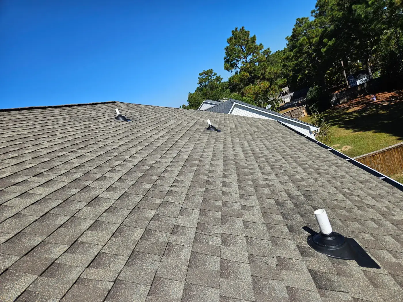 elite-home-services-nc-roof-full-view-new-pipe-boots-blue-sky.webp