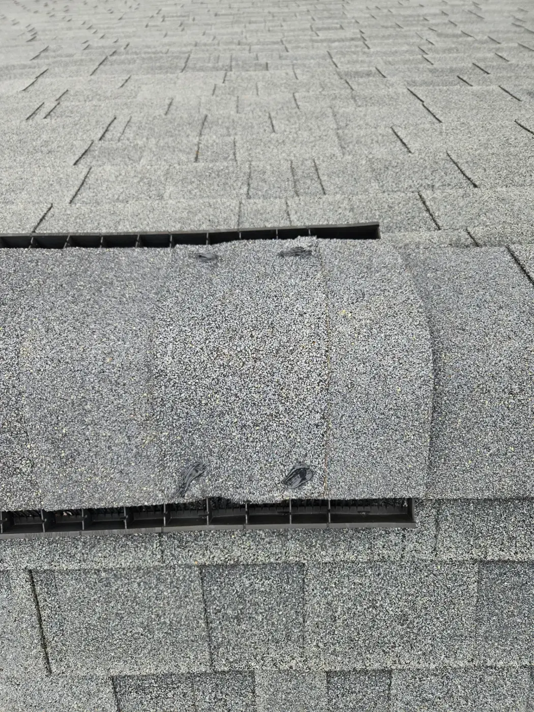 elite-home-services-nc-roof-ridge-vent-cap-closeup-detail.webp