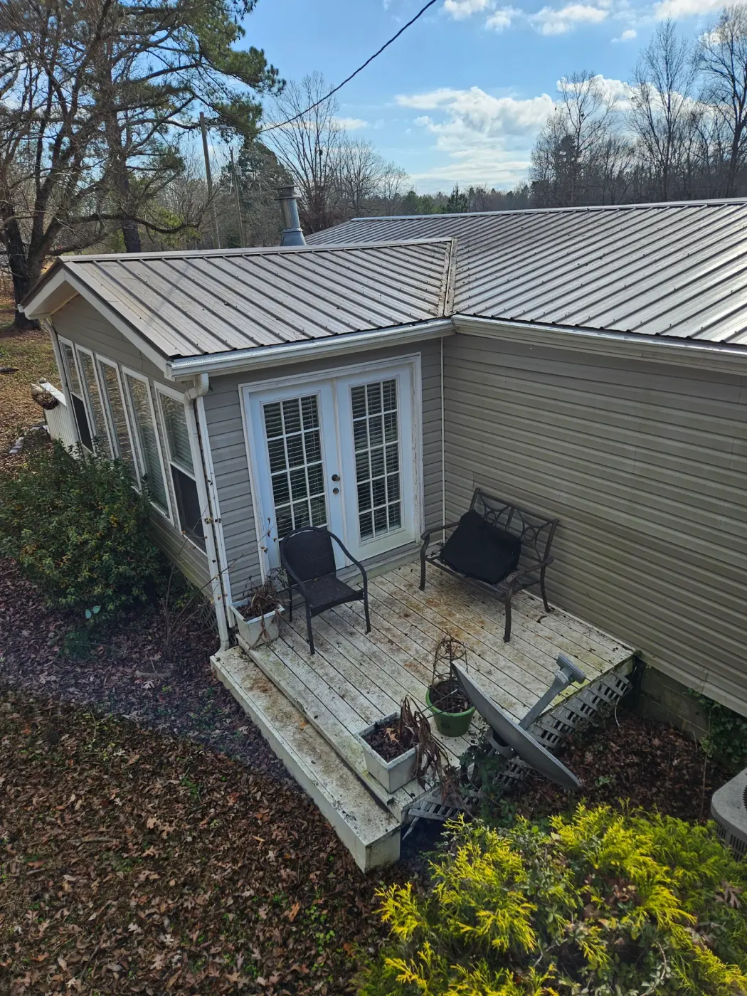 elite-home-services-nc-standing-seam-metal-roof-patio-french-doors.webp