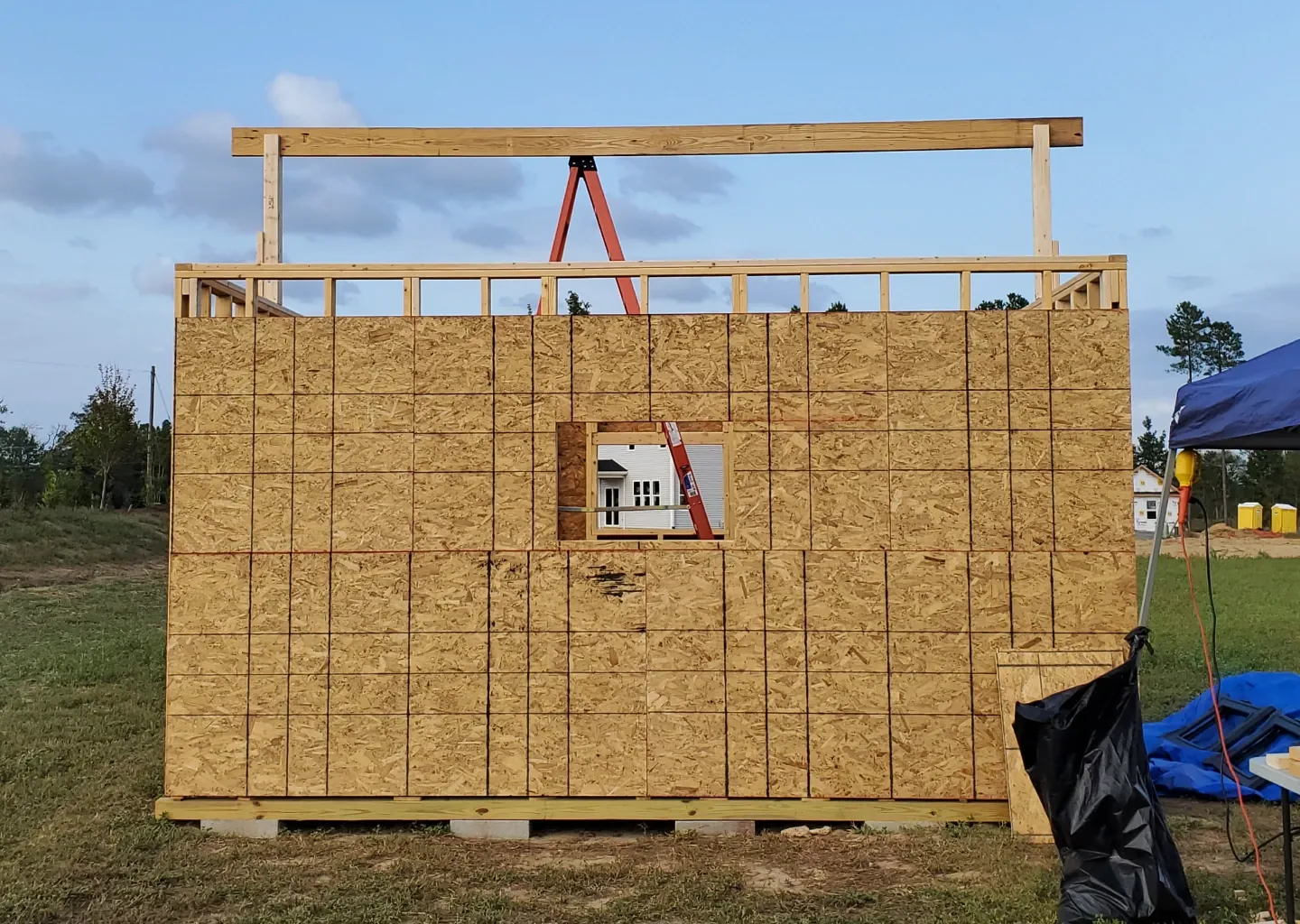 elite-home-services-nc-custom-shed-build-osb-sheathing-window-cutout.webp