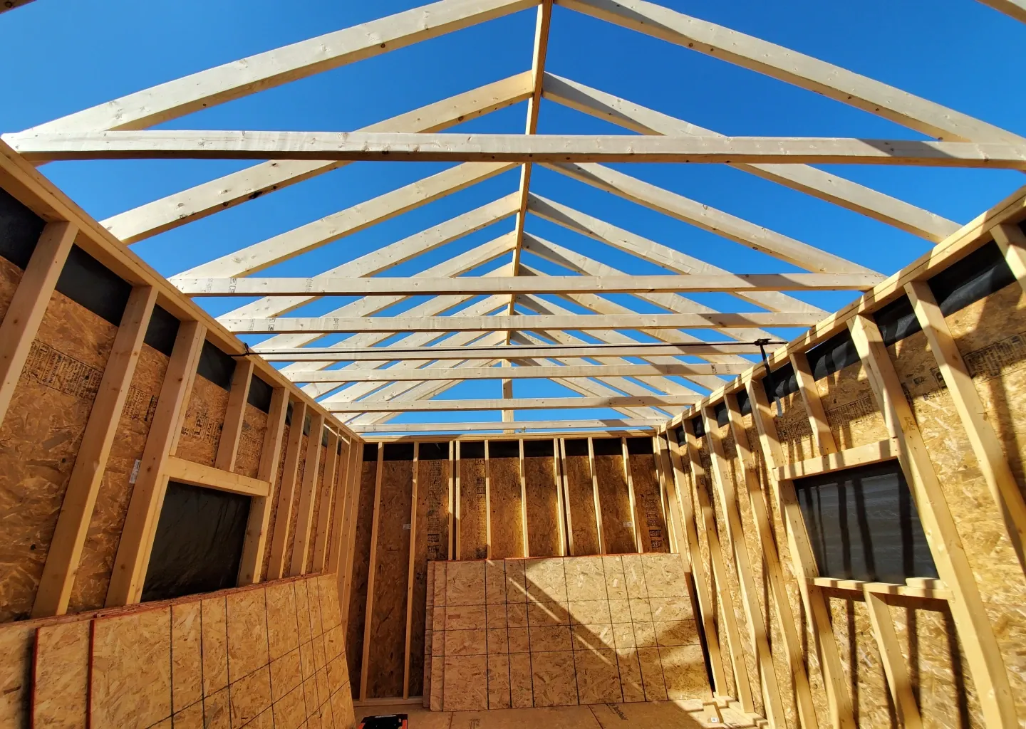 elite-home-services-nc-custom-shed-build-roof-trusses-interior.webp